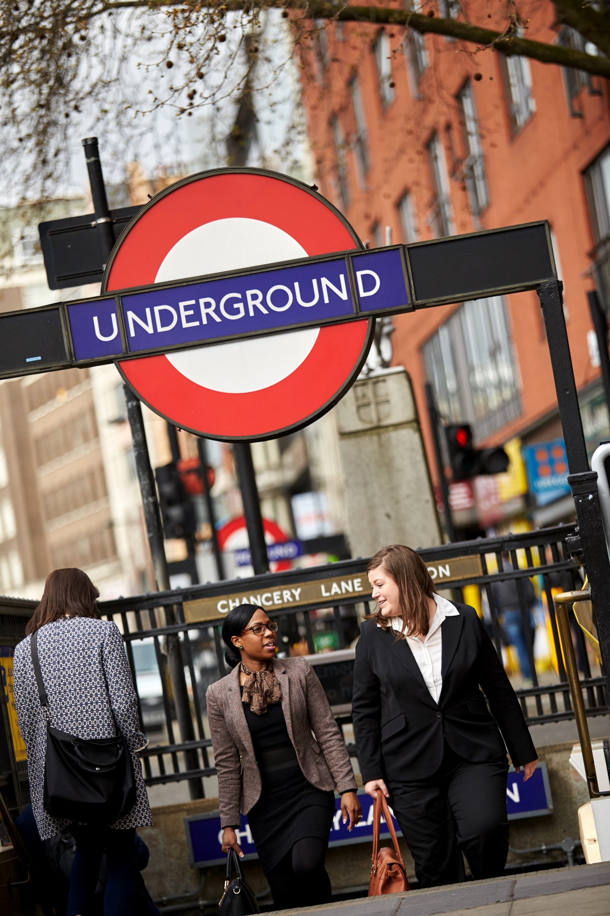 Two businesswomen coming out of the tube