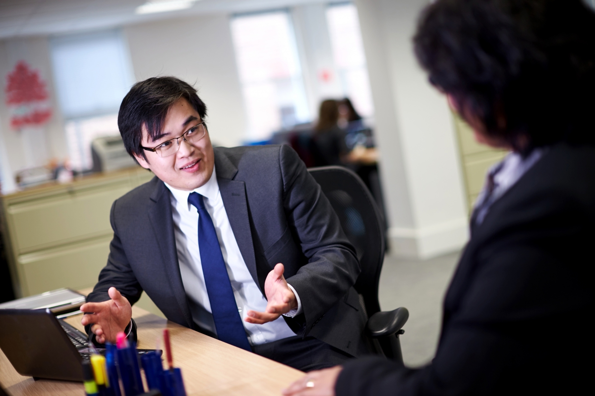 Business man talking to work colleague