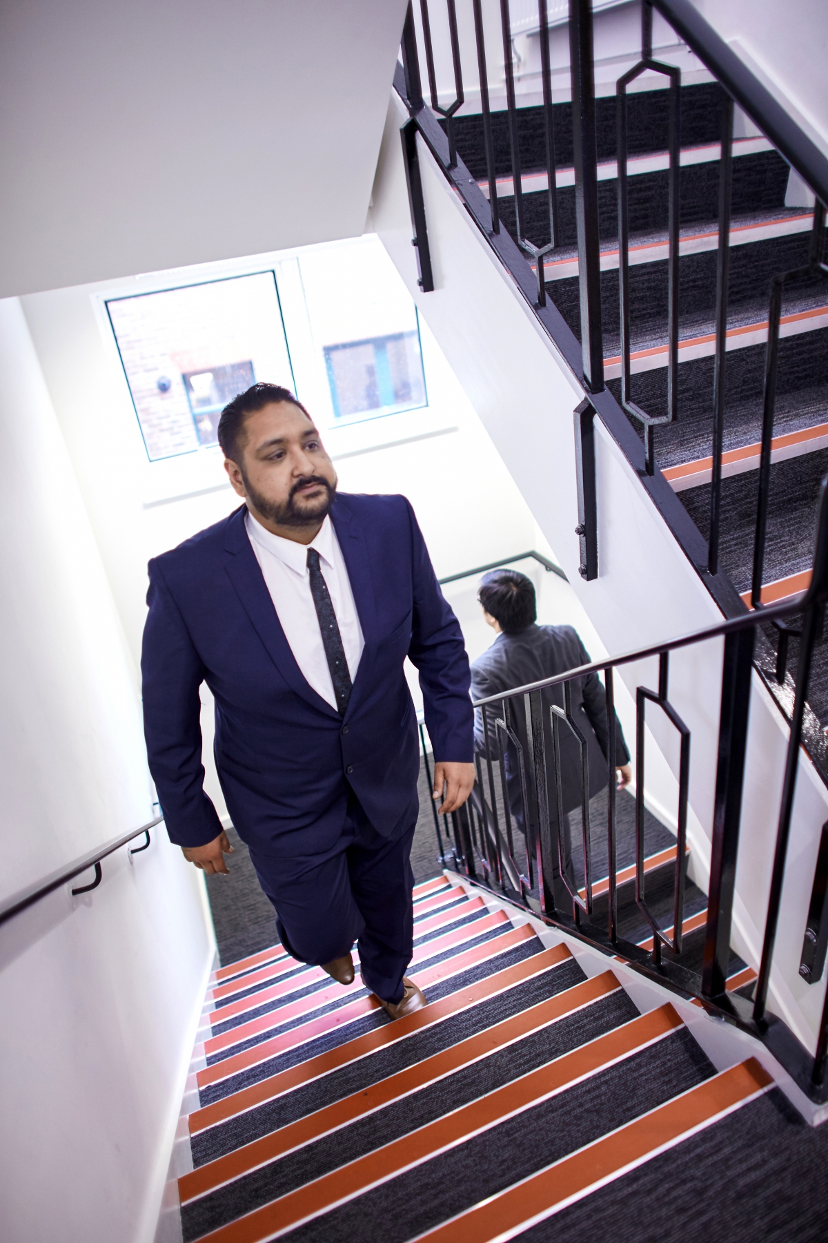 Business men walking up stairs
