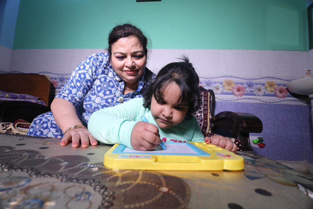 Woman and child playing at home