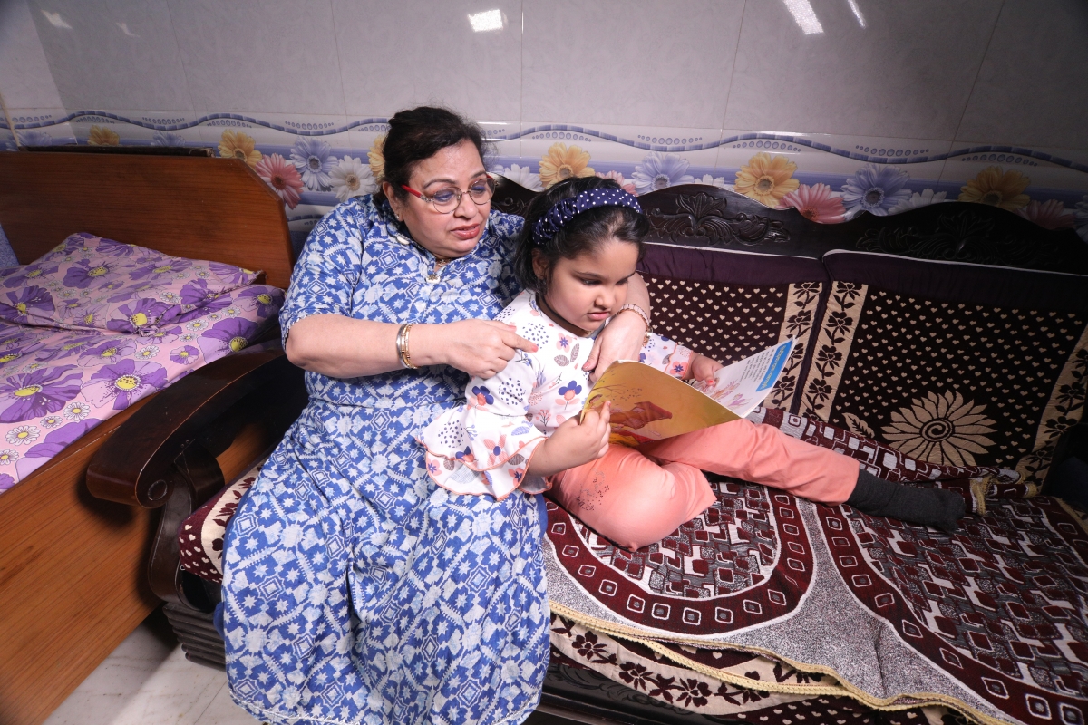 Woman and child reading at home