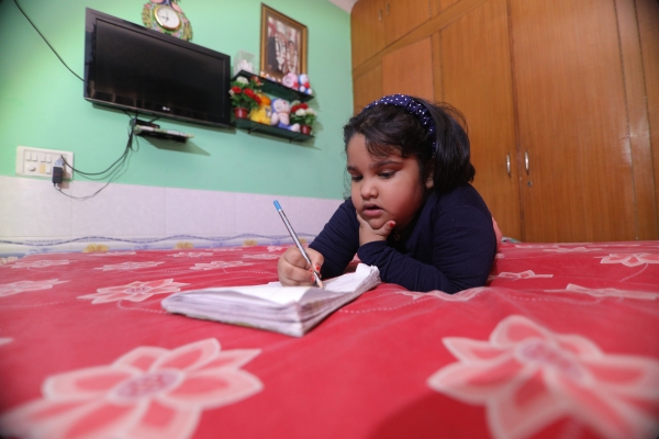 Child writing at home