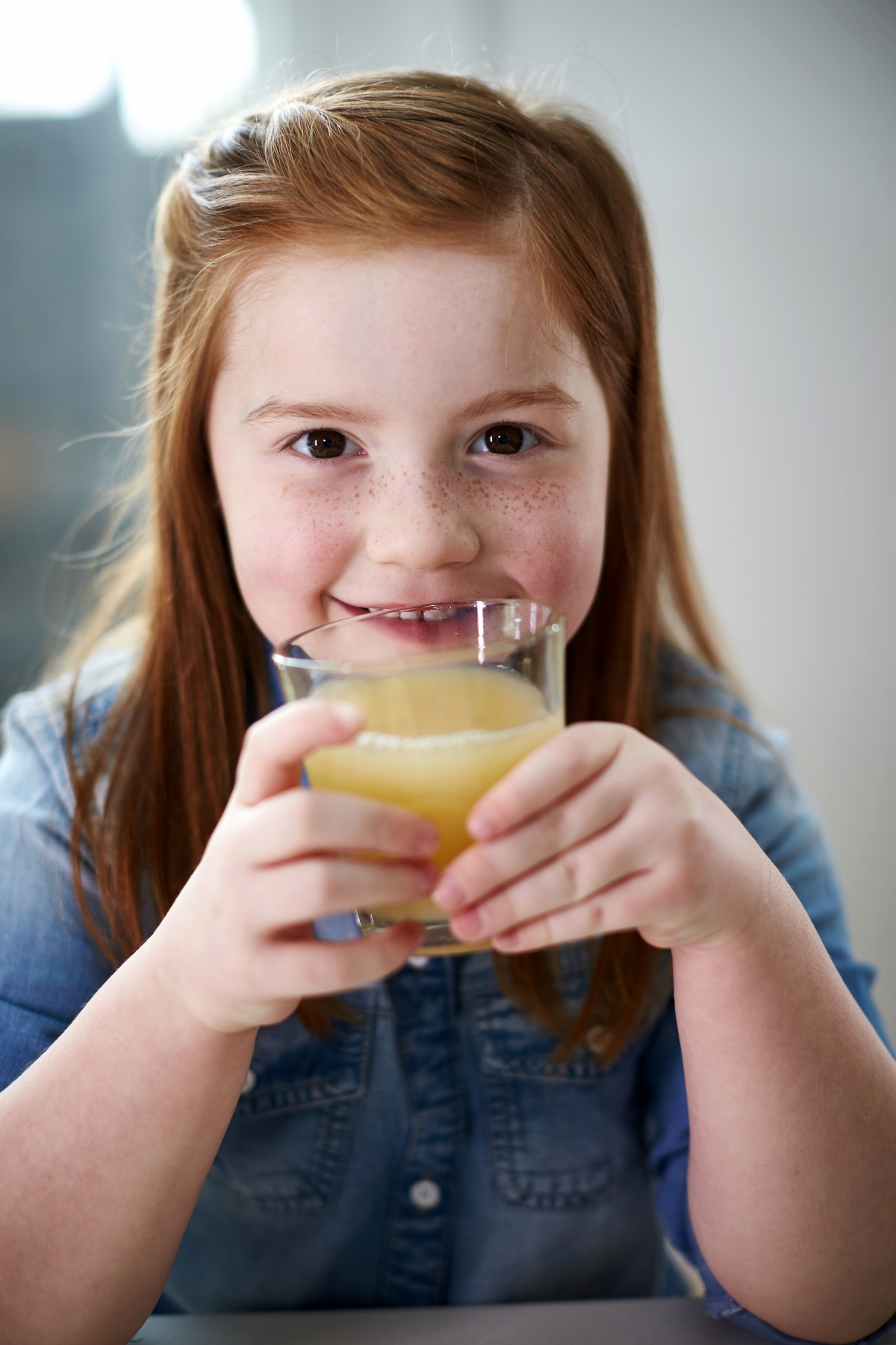 Girl drinking apple juice 