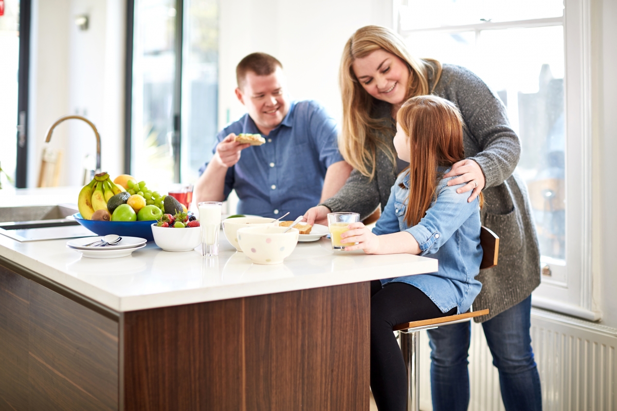 Family in the kitchen eating 