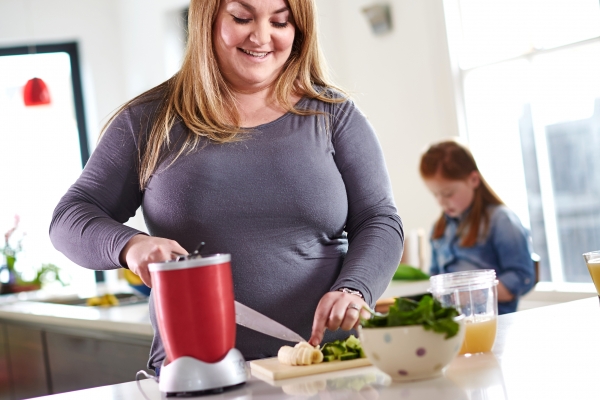 Mother making a healthy smoothie 