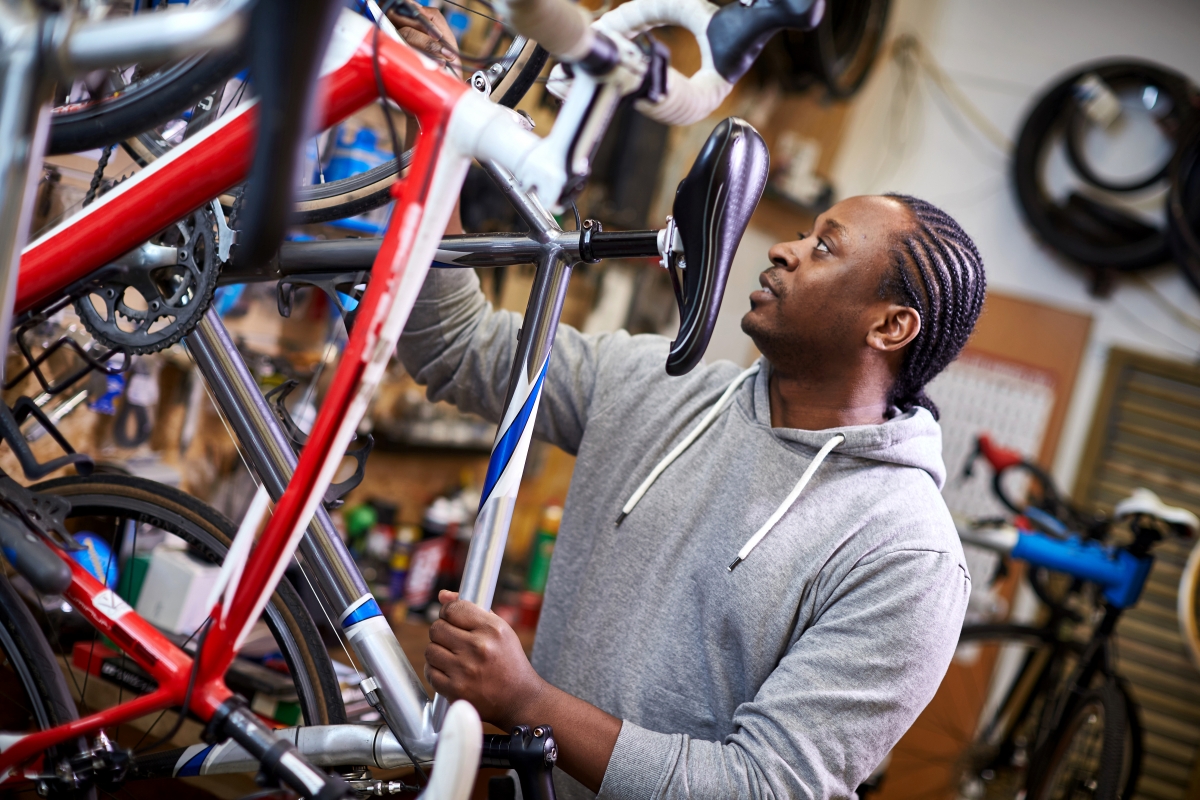 Man at work fixing a bike 