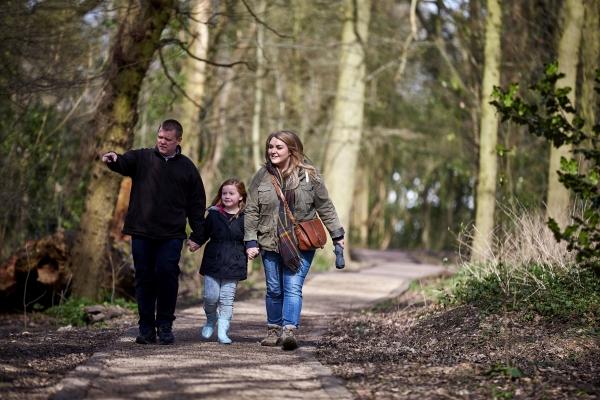 Family walking in the woods