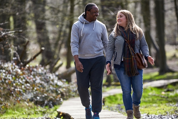 Couple taking a walk in the woods 