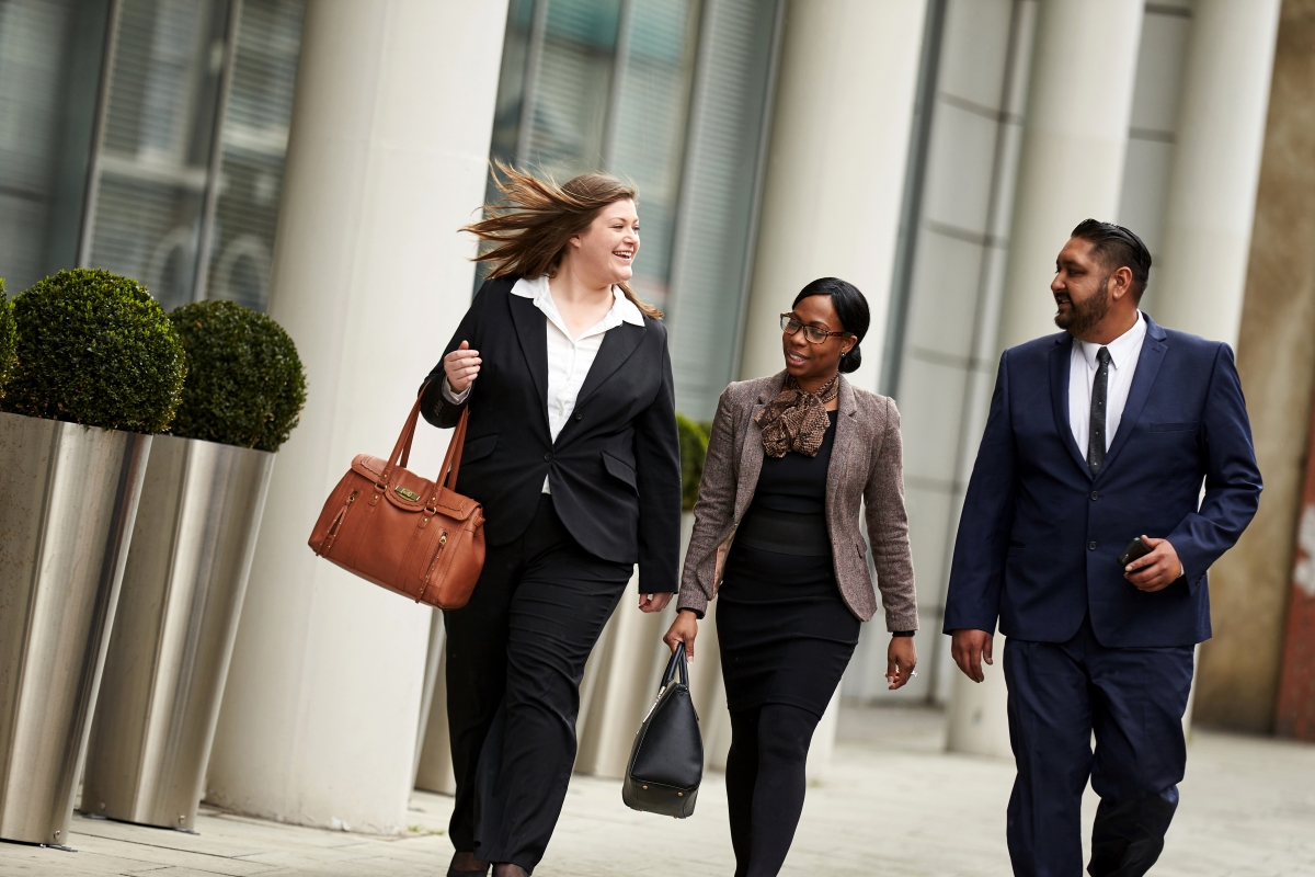 Work colleagues walking & talking