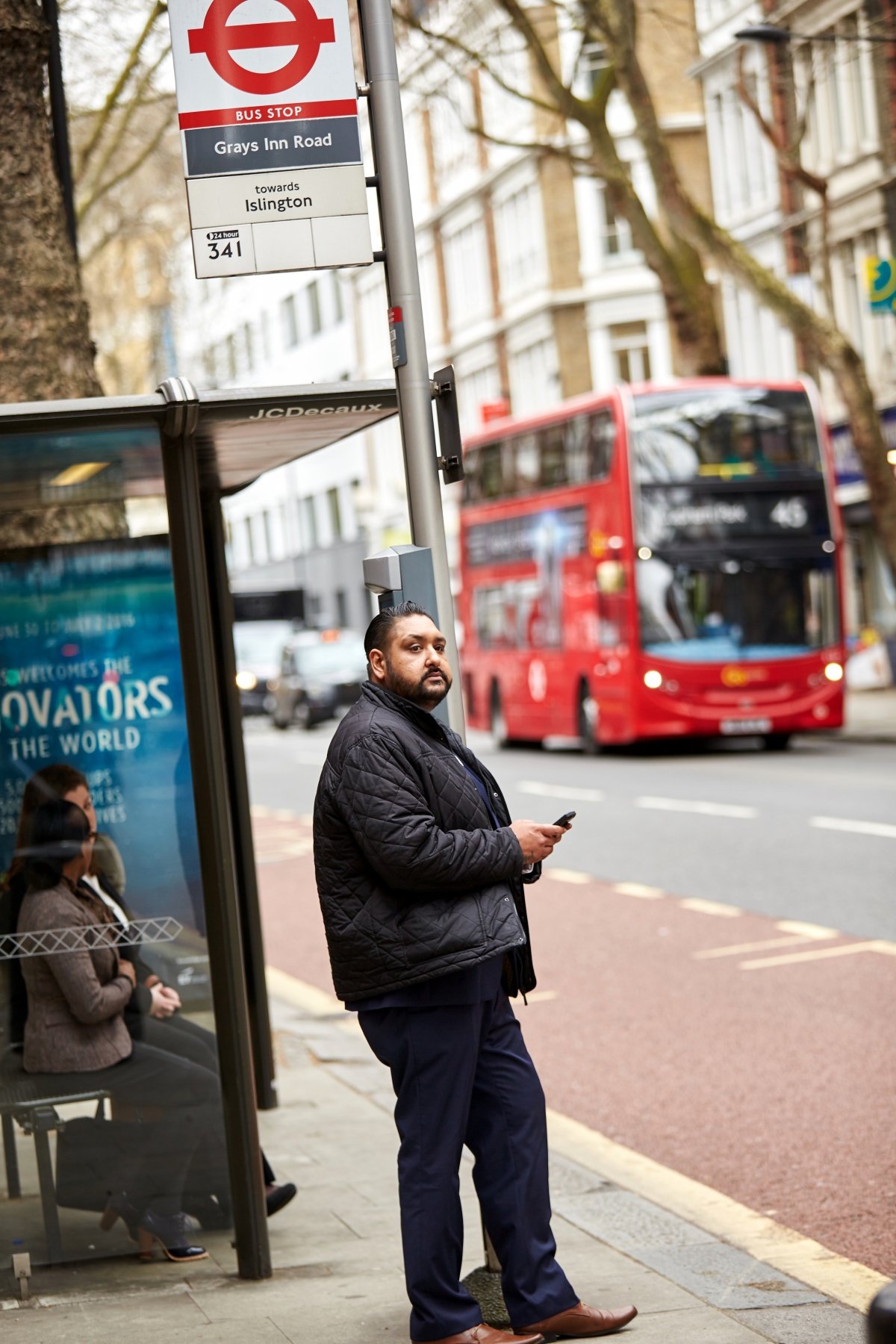 Man waiting at the bus stop 