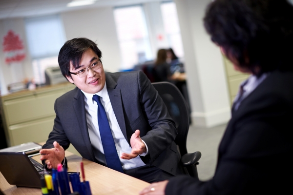 Business man talking to work colleague