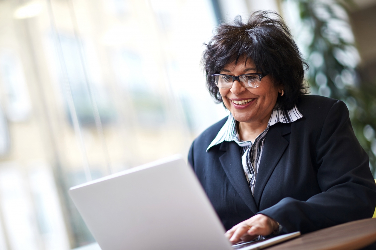 Lady with laptop in office