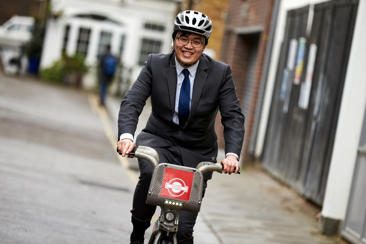Business man cycling to work 