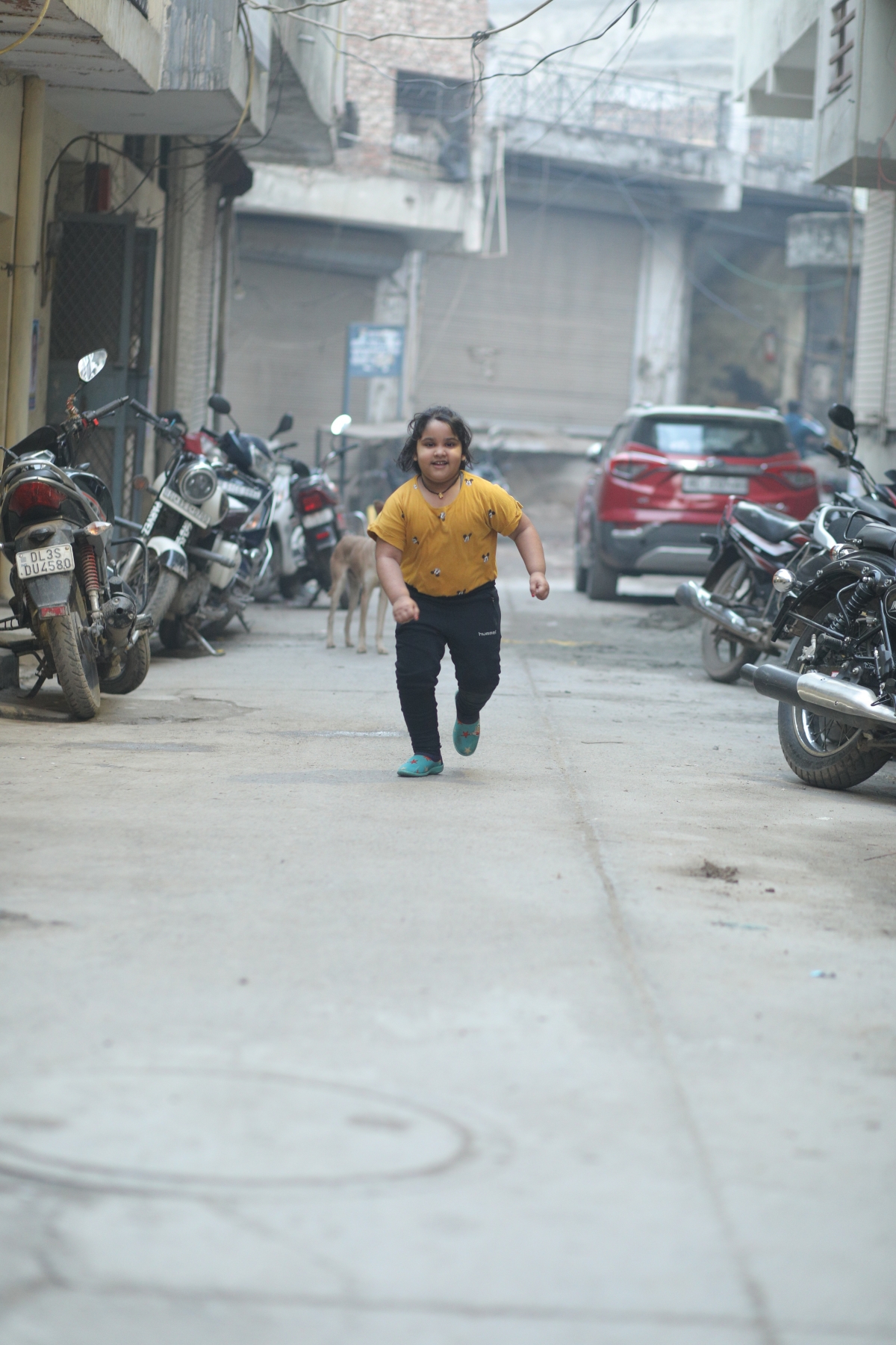 Child running in the street