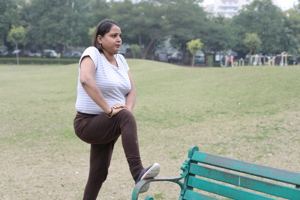 Woman stretching in a park