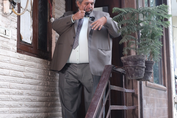 Man on steps with sunglasses