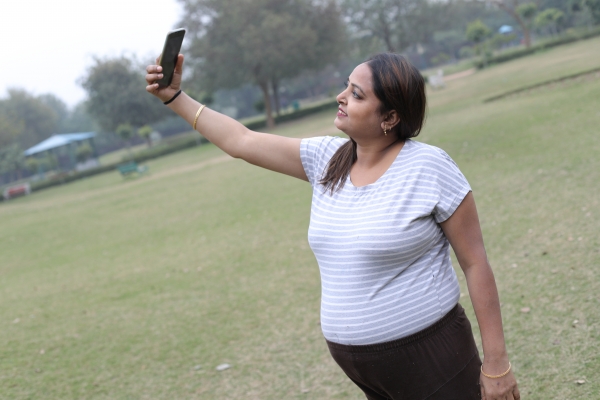 Woman taking a selfie outdoors