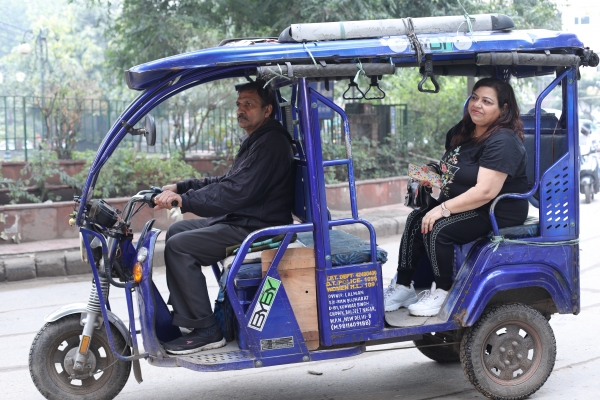 Woman on an auto rickshaw