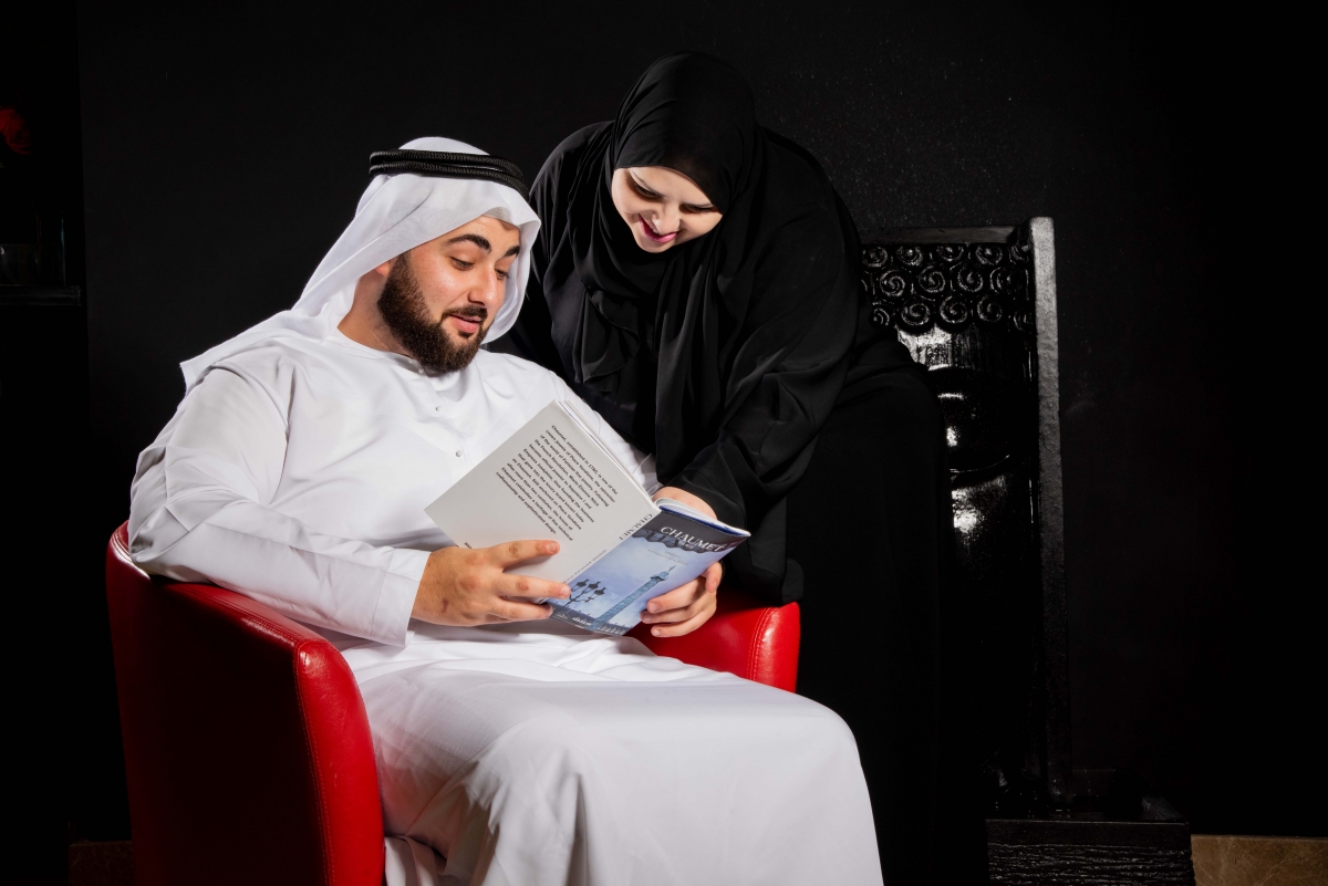 Man and woman reading book