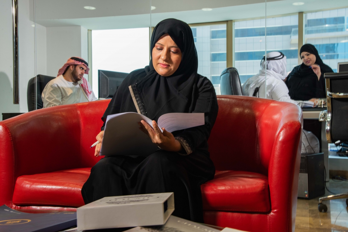 woman reading at work