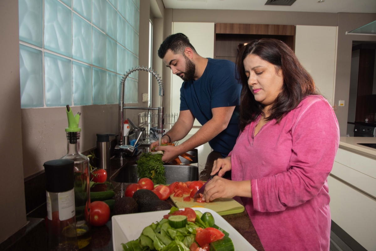 Woman and man preparing dinner