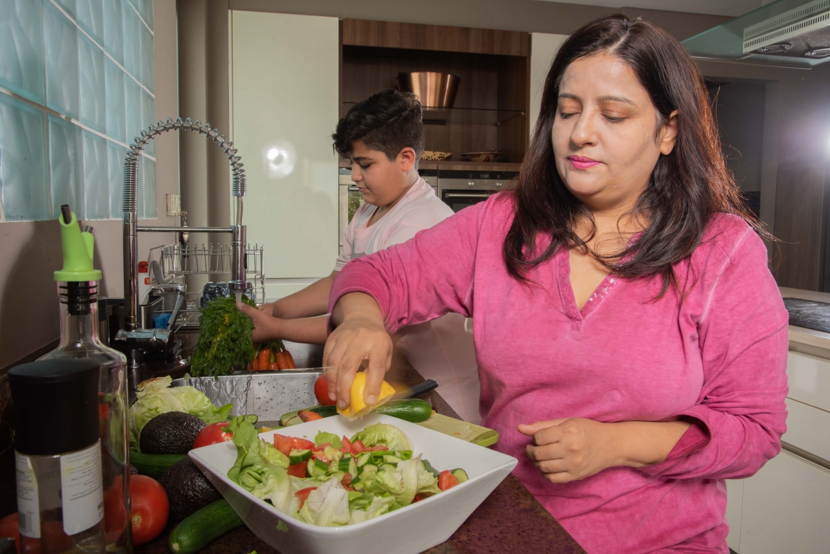 Woman and boy preparing dinner 2