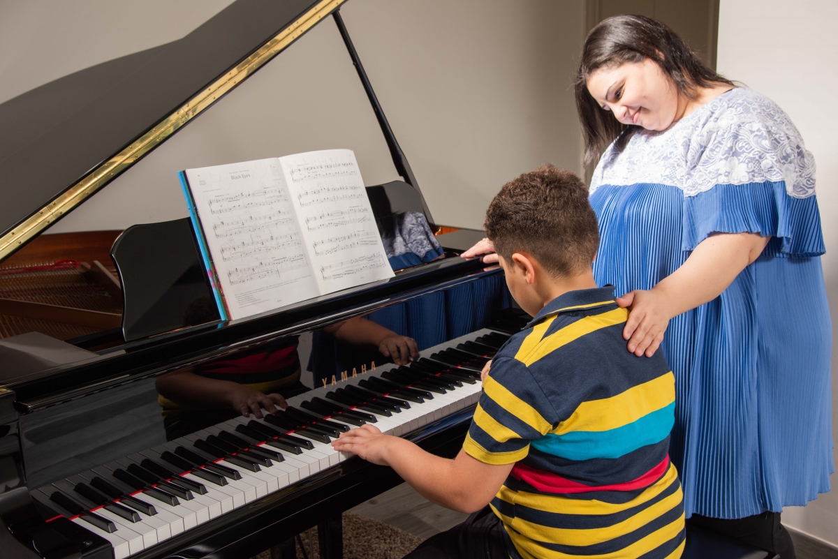 Child learning piano
